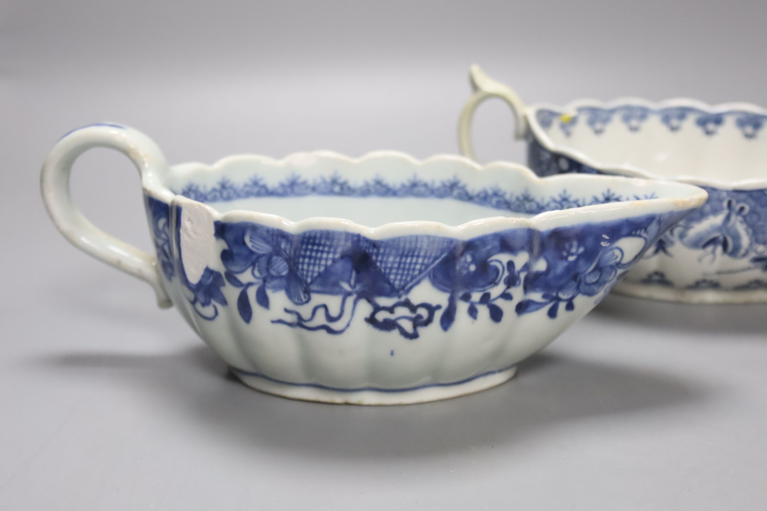 A Worcester Doughnut pattern blue and white sauceboat circa 1775 and two Chinese blue and white sauceboats, Qianlong period, longest 21cm